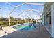 Inviting kidney-shaped pool with screened enclosure at 170 Bonita Dr, Rotonda West, FL 33947