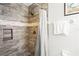 Shower stall with stone-like tile and glass enclosure at 170 Bonita Dr, Rotonda West, FL 33947