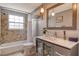 Cozy bathroom with tiled walls, modern fixtures, and a vanity with storage at 1705 Shoreland Dr, Sarasota, FL 34239