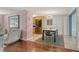 Modern dining area with stainless steel appliances, stylish chairs, and flamingo wallpaper at 1705 Shoreland Dr, Sarasota, FL 34239