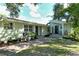 Charming front yard featuring landscaped greenery, a garden, and a walkway at 1705 Shoreland Dr, Sarasota, FL 34239