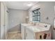 Bright laundry room with appliances, a window, and tile flooring at 1705 Shoreland Dr, Sarasota, FL 34239