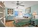 Light and airy bedroom with light blue walls and a comfortable bed at 1770 Benjamin Franklin Dr # 407, Sarasota, FL 34236