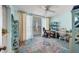 Home office with balcony access and built-in shelving at 1770 Benjamin Franklin Dr # 407, Sarasota, FL 34236