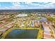 Aerial view of home with pool and lake access at 17722 Littleton Pl, Lakewood Ranch, FL 34202