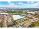 Aerial view of house, neighborhood, and lake at 17722 Littleton Pl, Lakewood Ranch, FL 34202