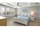 Bright bedroom with a king-size bed and ocean decor at 17722 Littleton Pl, Lakewood Ranch, FL 34202