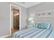 Guest bedroom with a full-size bed and coastal decor at 17722 Littleton Pl, Lakewood Ranch, FL 34202