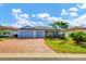 Two story home with two car garage and palm trees at 17722 Littleton Pl, Lakewood Ranch, FL 34202