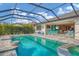 Resort-style pool and spa with screened enclosure and patio seating at 17722 Littleton Pl, Lakewood Ranch, FL 34202