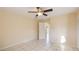 Light and airy bedroom with tile floors and access to hallway at 1778 Palm Dr, Venice, FL 34293