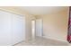 Bright bedroom with tile floors and mirrored closet doors at 1778 Palm Dr, Venice, FL 34293