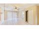 Bedroom with tile floors, closet, and sliding glass doors at 1778 Palm Dr, Venice, FL 34293