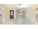 Dining room with tile floors and a view to the front door at 1778 Palm Dr, Venice, FL 34293