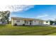 One-story house with a yard at 1778 Palm Dr, Venice, FL 34293