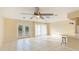 Spacious living area with tile floors and backyard access at 1778 Palm Dr, Venice, FL 34293