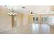 Bright and airy living room with tile floors and access to the backyard at 1778 Palm Dr, Venice, FL 34293