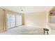 Living room features tile flooring and sliding glass doors at 1778 Palm Dr, Venice, FL 34293