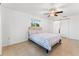 Bedroom with tiled floors and access to bathroom at 180 Aurora Rd, Venice, FL 34293