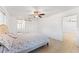 Bright bedroom with tiled floors and ceiling fan at 180 Aurora Rd, Venice, FL 34293