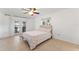 Bedroom with sliding door access to backyard at 180 Aurora Rd, Venice, FL 34293