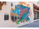 Colorful Venice Florida mural featuring airplanes and dolphins at 180 Aurora Rd, Venice, FL 34293