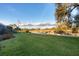 Green lawn, pond, and American flag in backyard at 2037 Silver Palm Rd, North Port, FL 34288