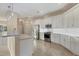 Modern kitchen featuring stainless steel appliances and white cabinets at 2037 Silver Palm Rd, North Port, FL 34288