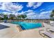 Inviting community pool with lounge chairs at 2037 Silver Palm Rd, North Port, FL 34288