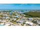 Aerial view of a single-Gathering home with a pool, located in a waterfront community at 211 84Th St, Holmes Beach, FL 34217