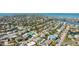 Aerial view of a home with a pool in a dense coastal neighborhood at 211 84Th St, Holmes Beach, FL 34217