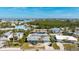 Aerial view showing teal house and pool at 211 84Th St, Holmes Beach, FL 34217