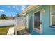 Outdoor shower and a teal-colored building exterior at 211 84Th St, Holmes Beach, FL 34217