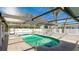 Relaxing kidney-shaped pool with a screened patio cover at 211 84Th St, Holmes Beach, FL 34217