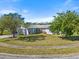 House with a large front yard and driveway at 2302 15Th W St, Palmetto, FL 34221