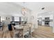 Bright dining room with white table and chandelier at 2302 15Th W St, Palmetto, FL 34221