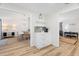 Bright hallway with white cabinets, view into dining area and living room at 2302 15Th W St, Palmetto, FL 34221