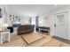 Living room with gray sectional sofa and coastal decor at 2302 15Th W St, Palmetto, FL 34221