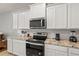 Modern kitchen with stainless steel appliances and granite countertops at 2850 Midnight Pearl Dr, Sarasota, FL 34240