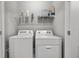 Laundry room with washer and dryer, and storage at 2850 Midnight Pearl Dr, Sarasota, FL 34240