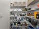 Well-organized pantry with ample shelving for storage at 2850 Midnight Pearl Dr, Sarasota, FL 34240