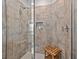 Spacious shower with tile surround and built-in seat at 2850 Midnight Pearl Dr, Sarasota, FL 34240