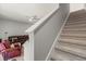 Carpeted staircase leading to the second floor at 2850 Midnight Pearl Dr, Sarasota, FL 34240