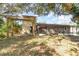 Backyard with wooden pergola and screened patio at 288 Ambler St, Port Charlotte, FL 33954