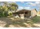 Large screened porch with patio furniture at 288 Ambler St, Port Charlotte, FL 33954