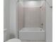 Simple bathroom with a shower/tub combo and tile surround at 2930 61St E Dr, Ellenton, FL 34222