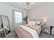 Serene bedroom with a queen-size bed, and gray carpeting at 2930 61St E Dr, Ellenton, FL 34222