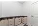 Laundry room with custom cabinets and additional storage at 2930 61St E Dr, Ellenton, FL 34222