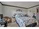 Well-lit bedroom featuring a double bed and wicker furniture at 315 30Th W Ave # B210, Bradenton, FL 34205