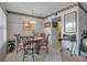 Cozy dining area featuring a round table, four chairs, and a decorative accent wall at 315 30Th W Ave # B210, Bradenton, FL 34205